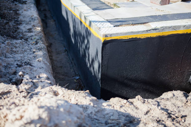 Professional Waterproofing technician working in Mount Olive, AL